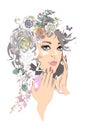 A beautiful girl`s face with curly hair decorated with flowers and butterflies  with her hands in lines. Royalty Free Stock Photo